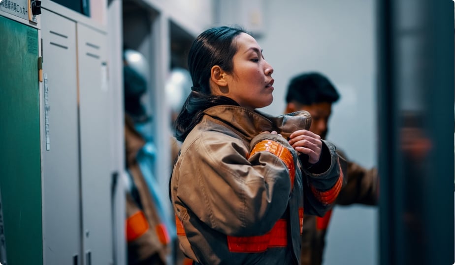female firefighters suiting up