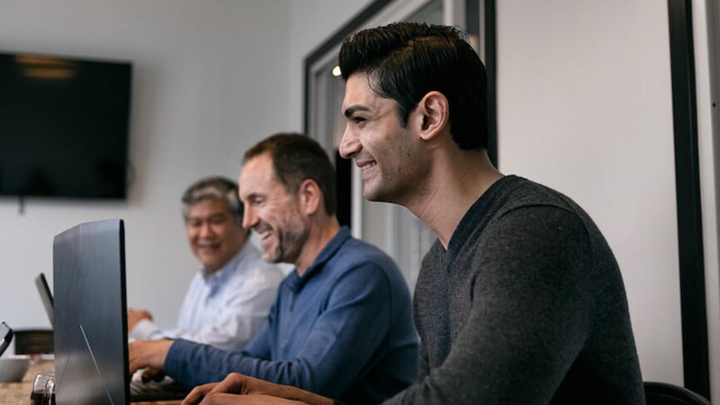 cultural-fit-male-colleagues-working-together