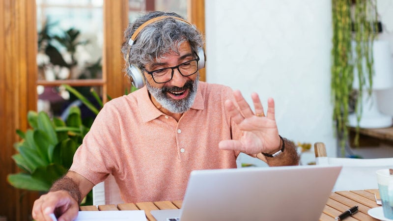 employee-engagement-man-waving-laptop