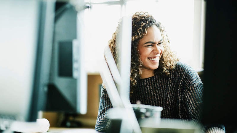 incentives-for-employees-woman-smiling-at-work