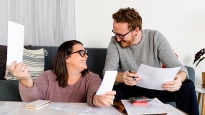 financial-wellness-couple-with-papers