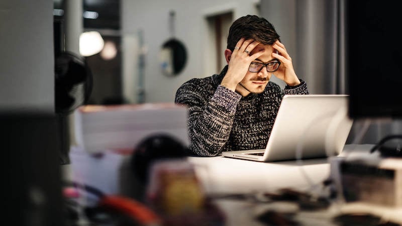 hustle-culture-man-working-late-on-laptop