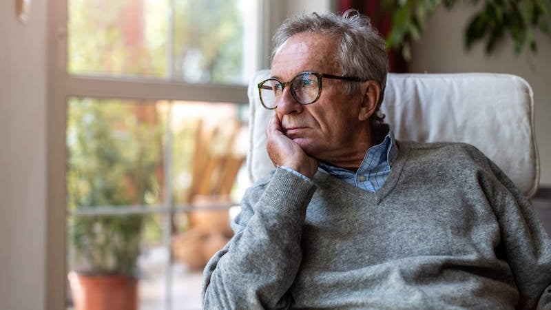 invisible-illness-older-man-looking-out-window