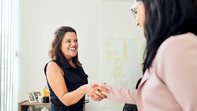 new-manager-training-woman-shaking-hands-with-manager