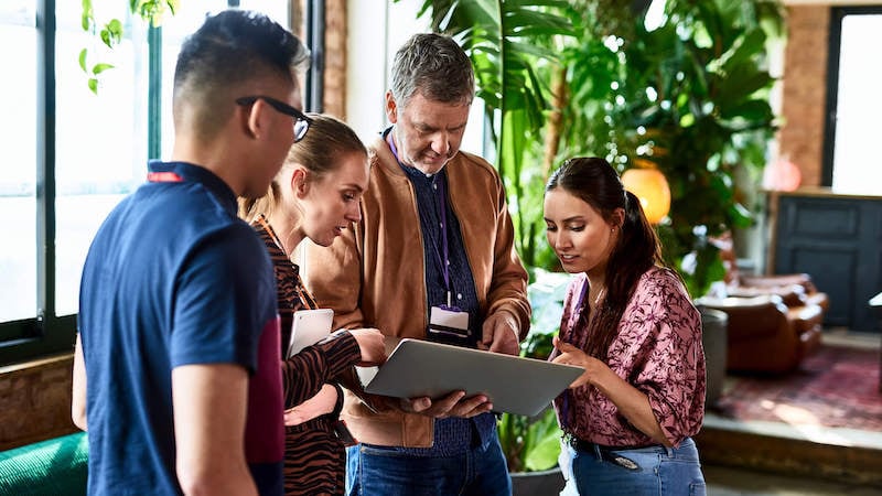 performance-review-questions-team-meeting-in-lobby