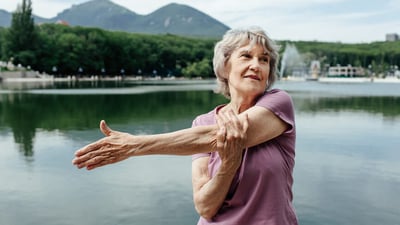 shadow-work-woman-stretching-at-lake