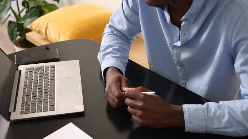 talent-acquisition-man-on-laptop-hands-only