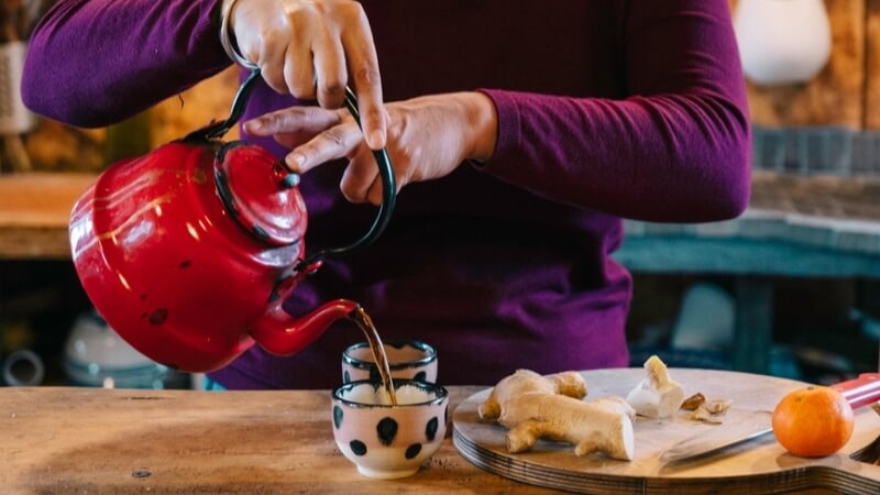 boost-immune-system-person-makes-a-cup-of-tea