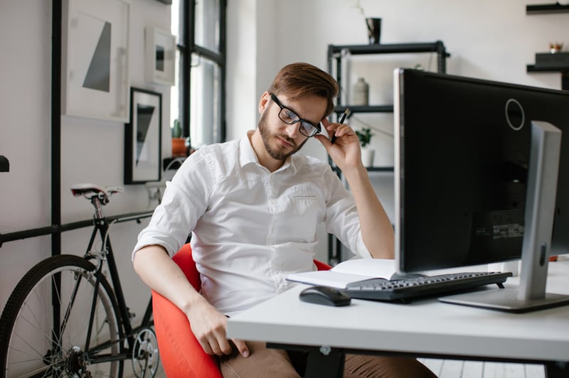 businessman-sitting-at-computer-delegation