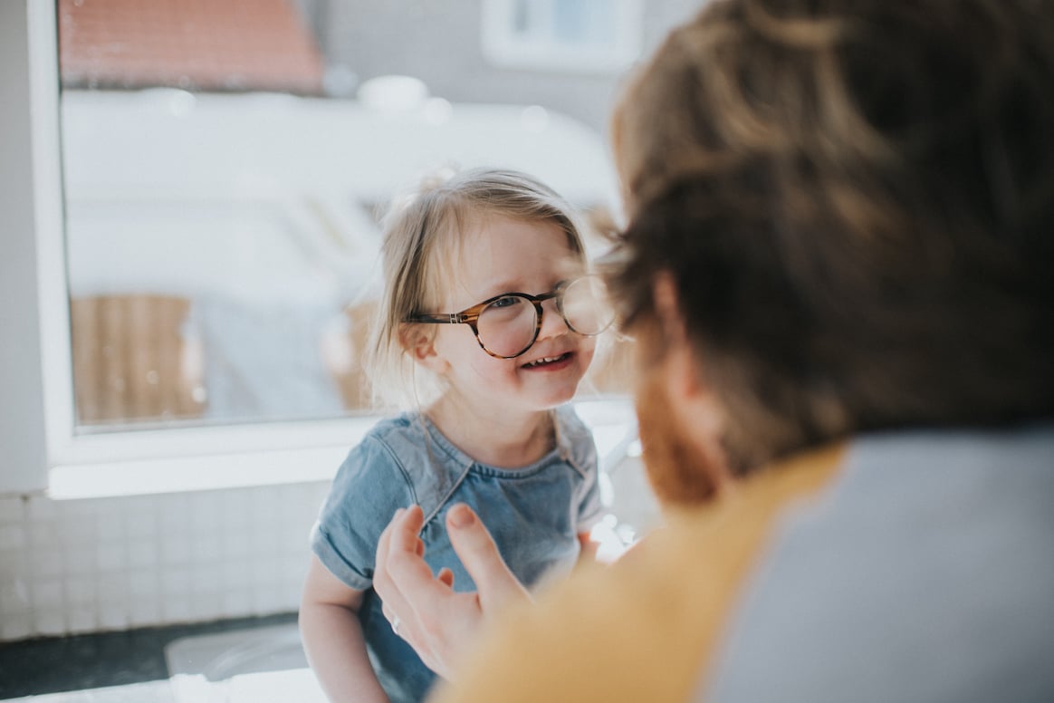 caregiver-fatigue 4 - dad-helps-daughter-with-glasses