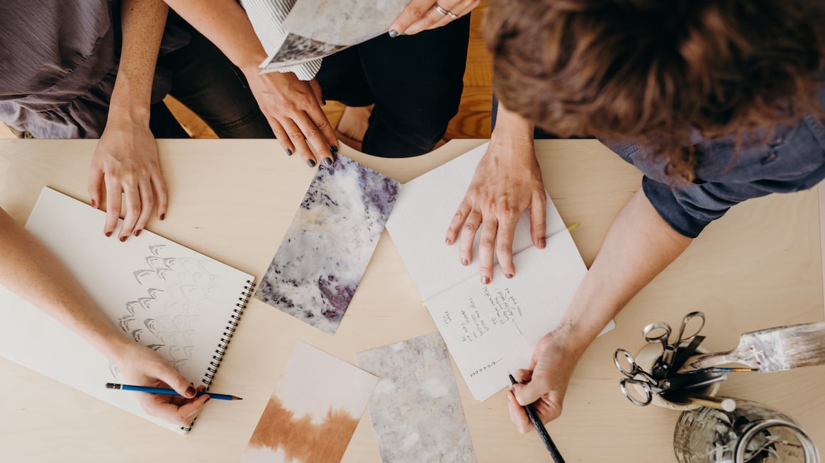 collaboration-at-work-top-down-view-of-people-working