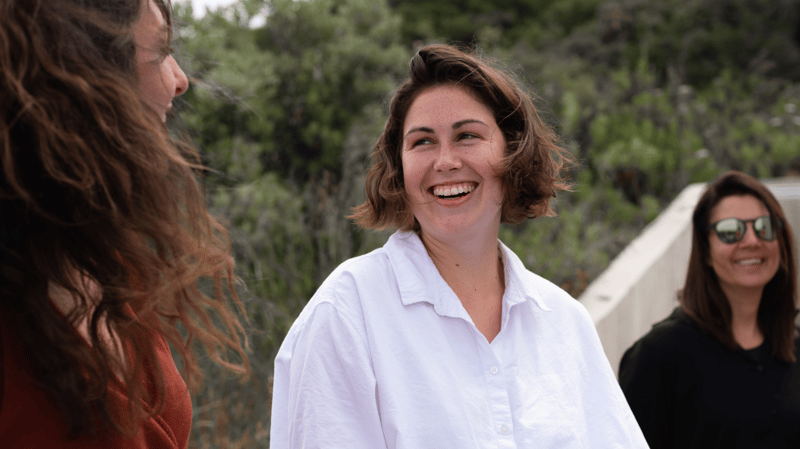 women-enjoying-a-joke-together-outside