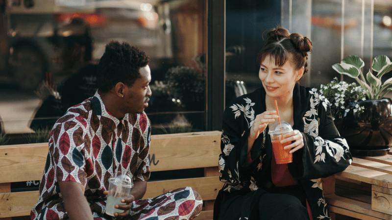 two-coworkers-share-a-break-outside-connection-companies