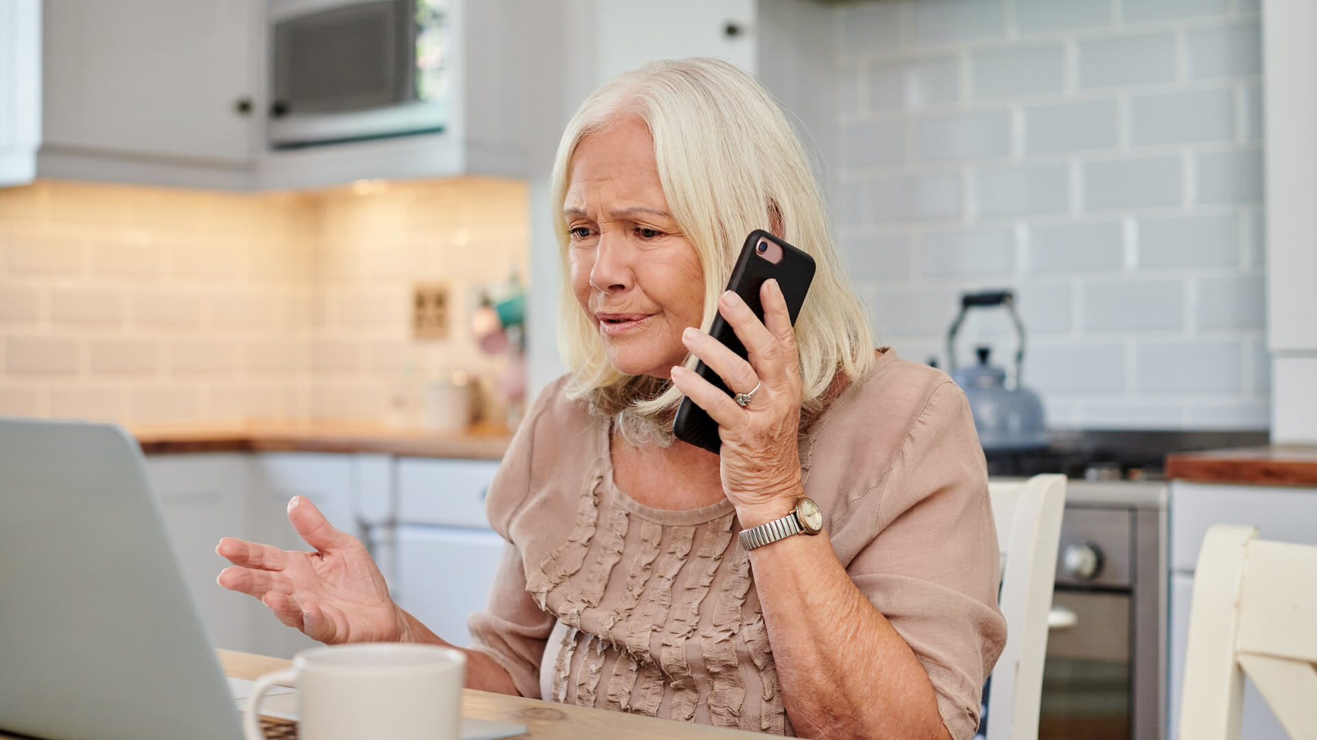 debt-and-mental-health-person-paying-bills-on-phone-with-bill-company