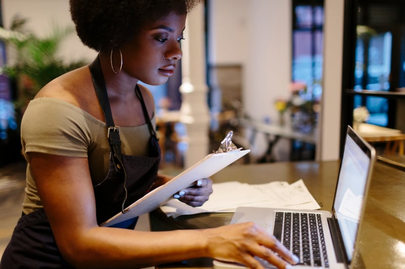 woman-working-on-notepad-and-laptop-ego-driven