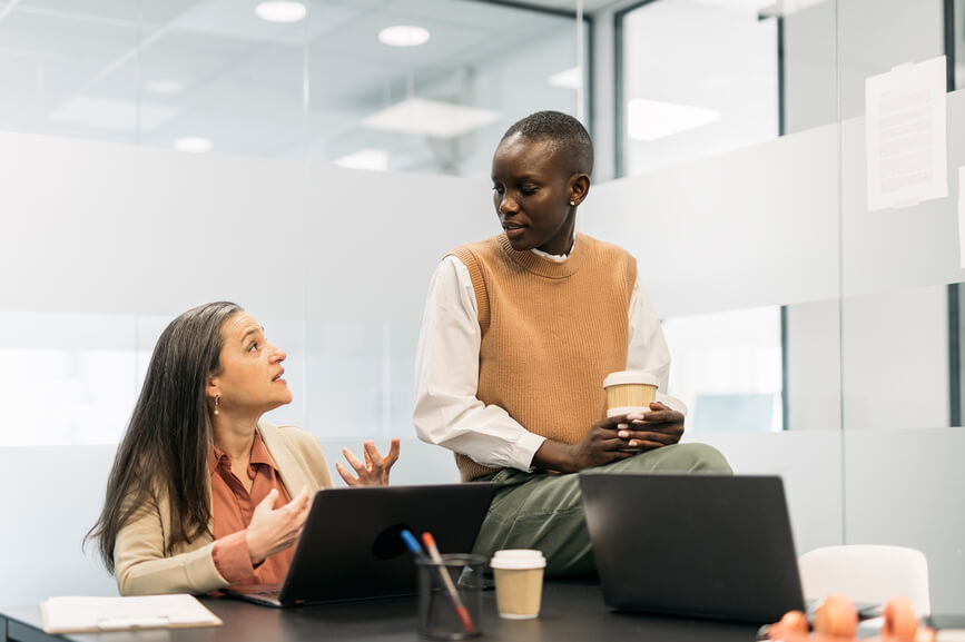 coworkers-discussing-employee-attrition
