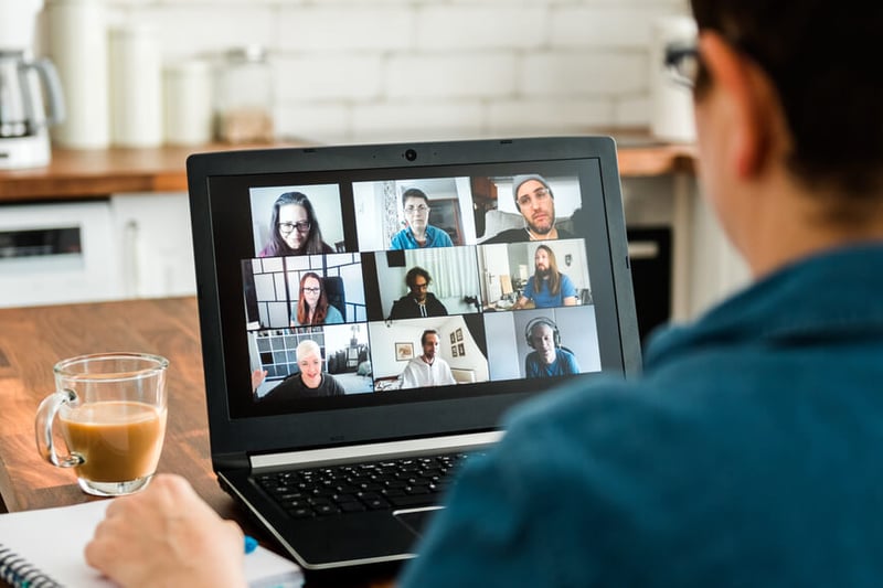 employee-sits-in-a-virtual-team-meeting-wellness-challenge