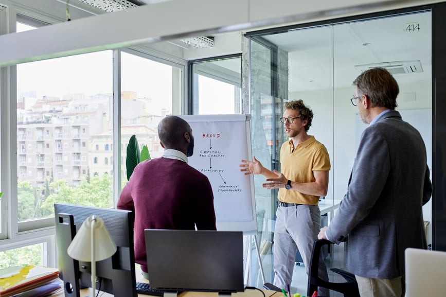 three-men-in-business-presentation-expert-power