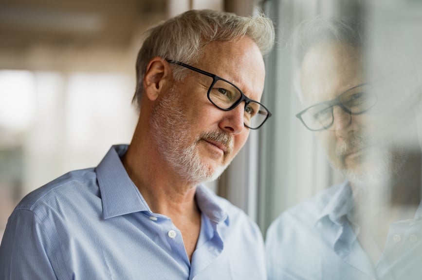 exposure-therapy-man-stares-out-window