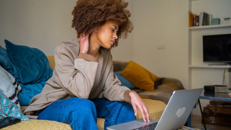 invisible-disabilities-person-with-neck-pain-at-computer