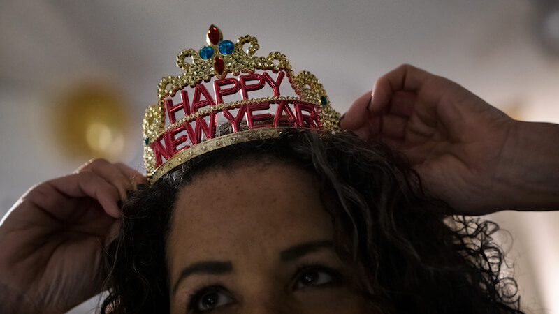 new-years-resolutions-ideas-person-with-new-year-crown