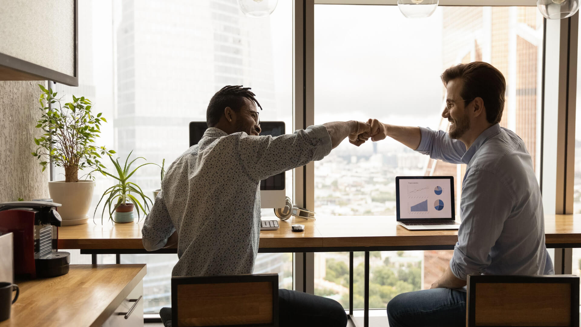 two-people-fist-bump-in-office-perfect-is-the-enemy-of-good