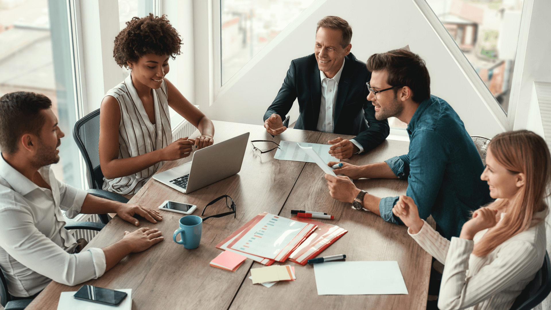 stack-ranking-team-sits-at-a-table