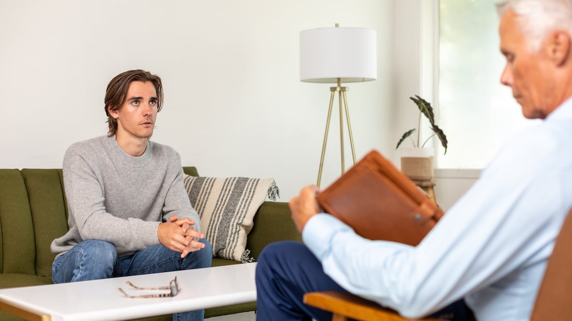what-is-emdr-therapy-person-sits-in-therapy-session