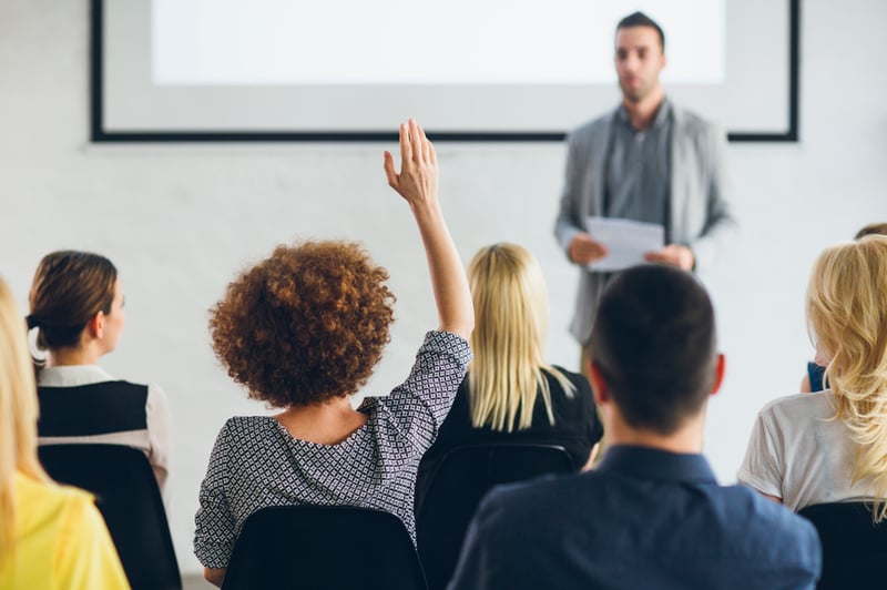 woman-asking-a-question-in-a-meeting-gaslighting-at-work