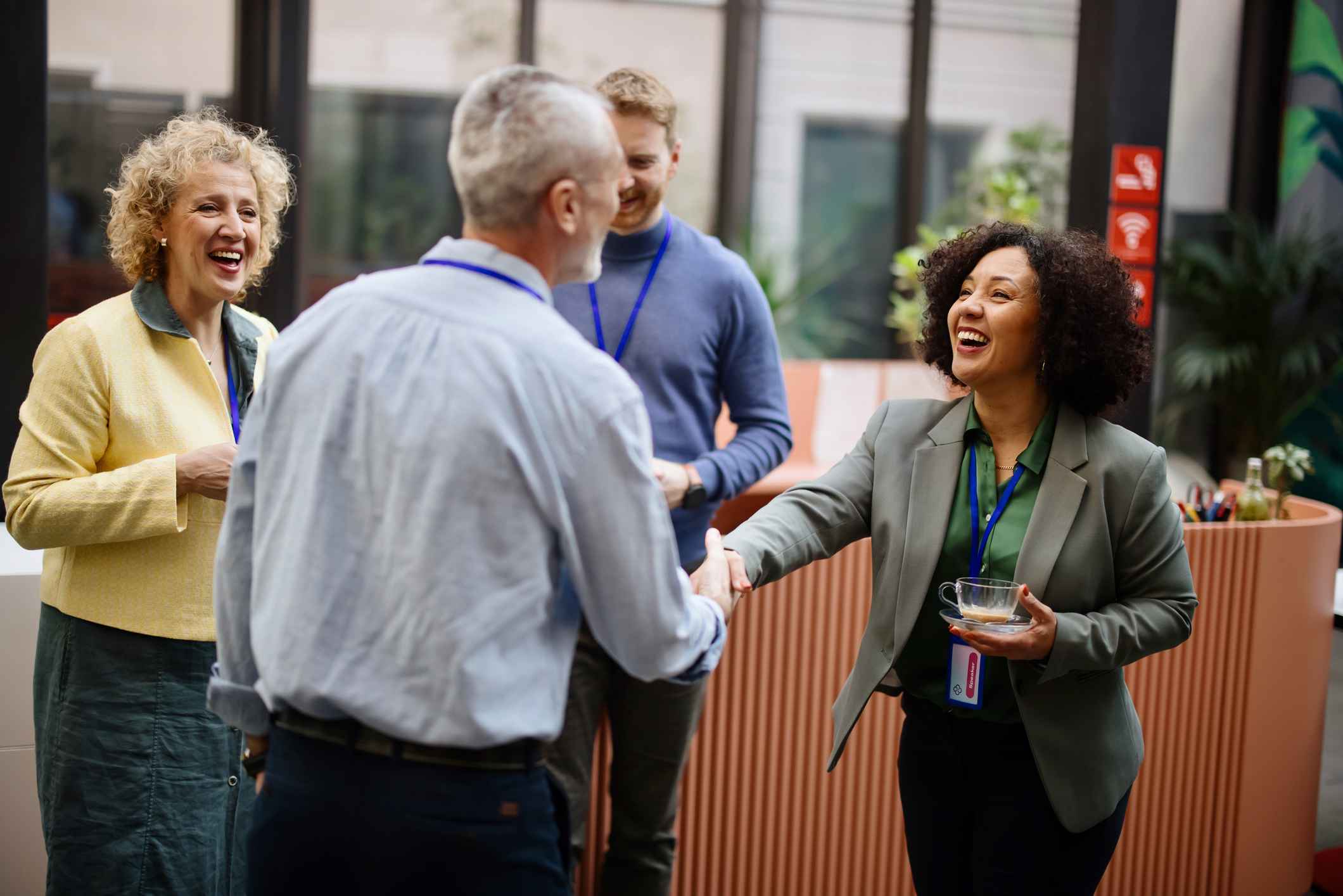 Business-people-greeting-each-other-how-to-get-noticed-by-upper-management