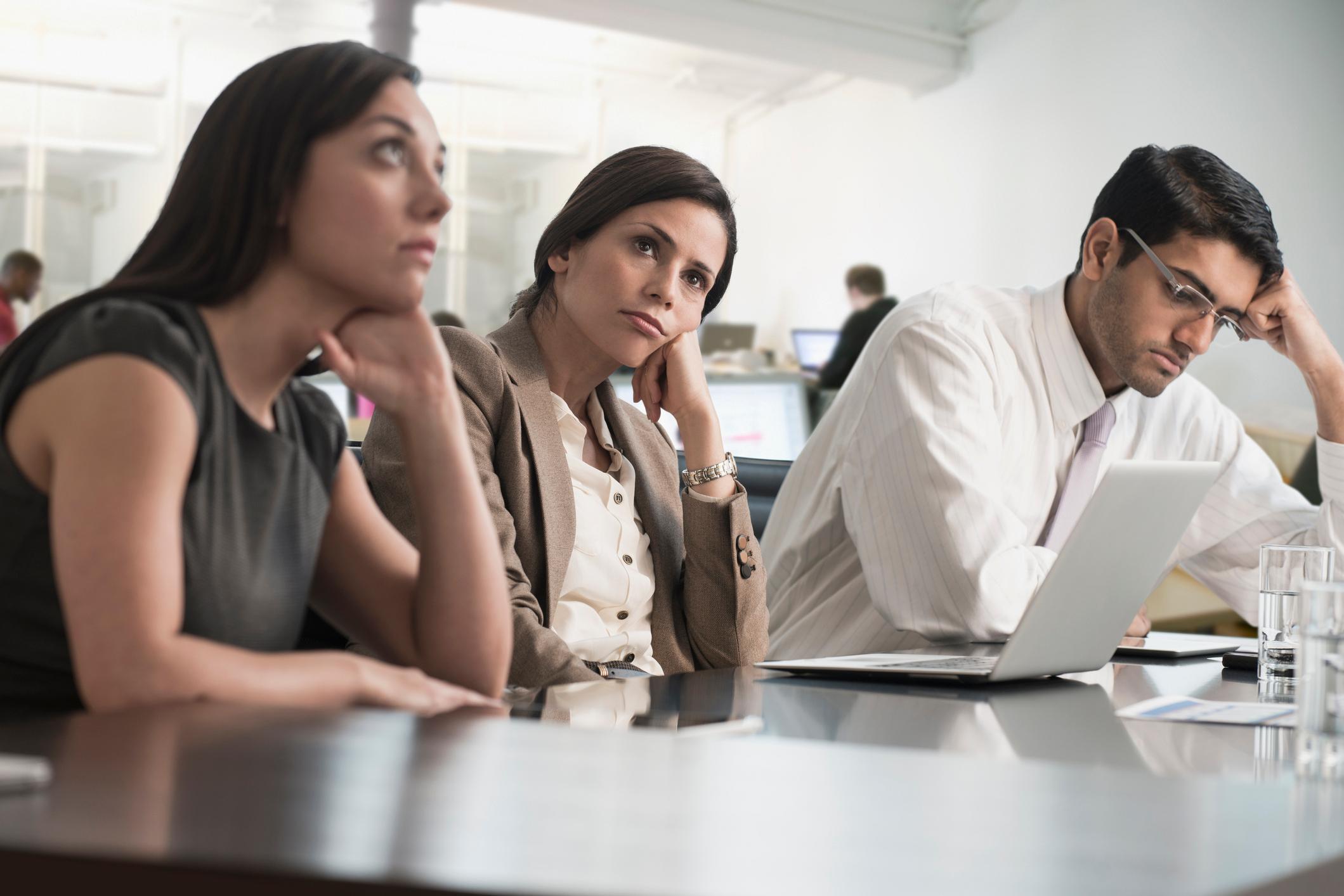 Coworkers-bored-at-meeting-worried-about-getting-fired