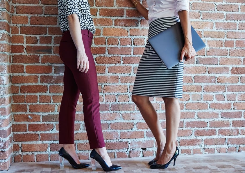 two-friends-talking-at-their-workplace-office-politics