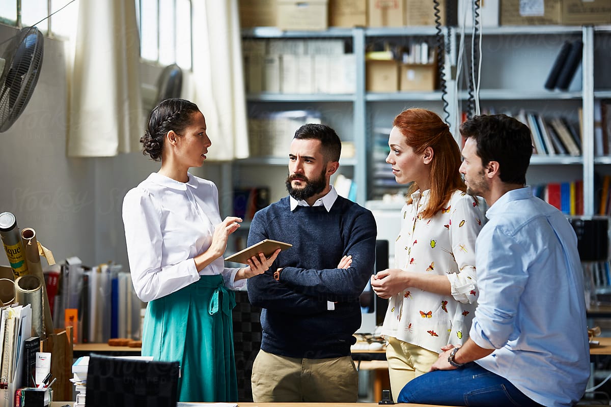Images/blogs/distributed leadership - woman-holding-a-tab-discussing-with-three-people-distributed-leadership.jpg woman-holding-a-tab-discussing-with-three-people-distributed-leadership
