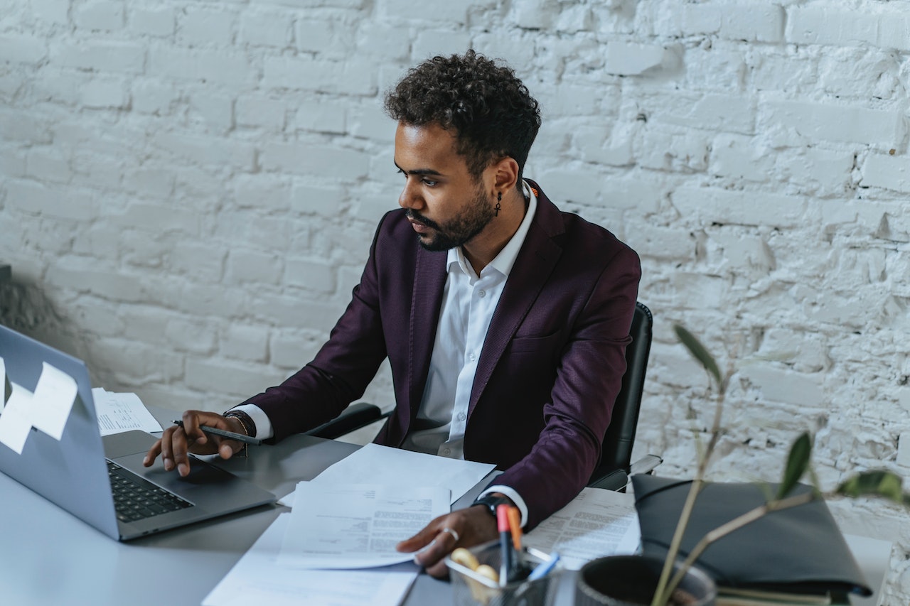 Man-doing-research-in-his-computer-voluntary-layoffs