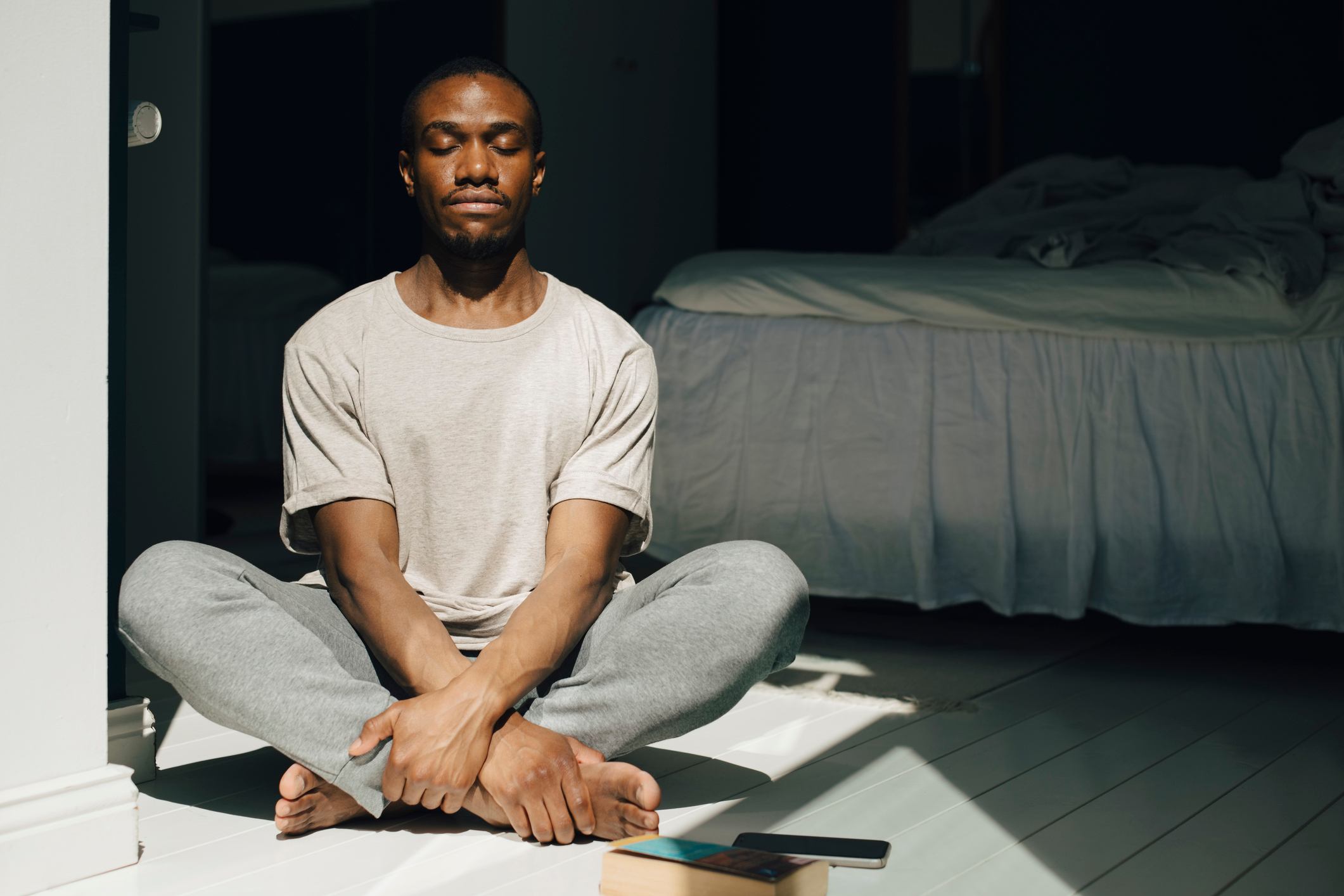 Man-in-front-of-sunlight-meditating-with-eyes-closed-how-to-adjust-to-night-shifts