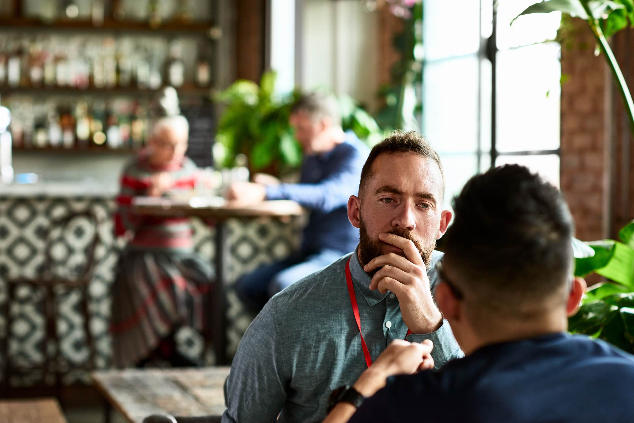 Man-listening-thoughtfully-to-colleague-importance-of-patience-in-life