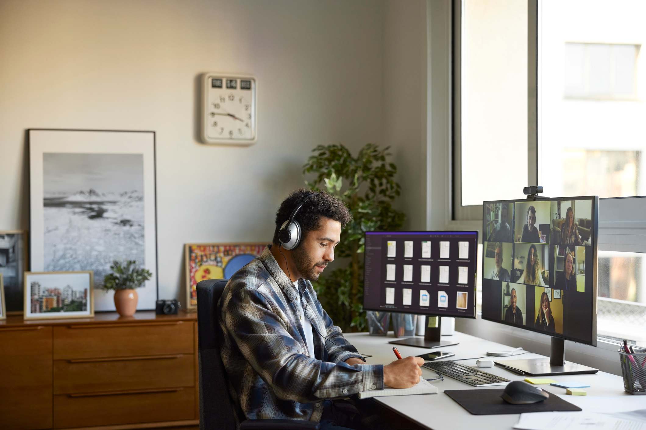 Man-on-videocall-at-home-with-coworkers-bad-day-at-work