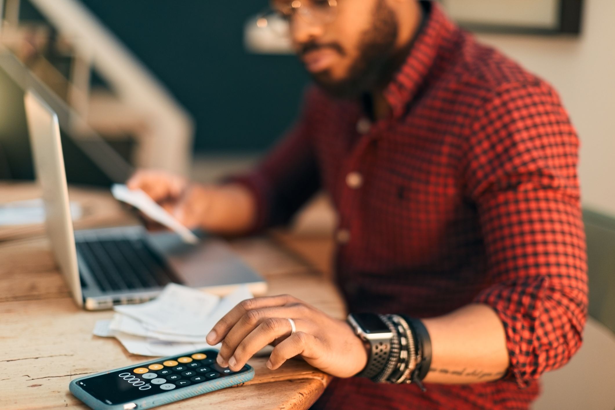 Man-using-a-calculator-second-interview-questions