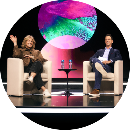 Brenè Brown and Alexi Robichaux on a stage together smiling
