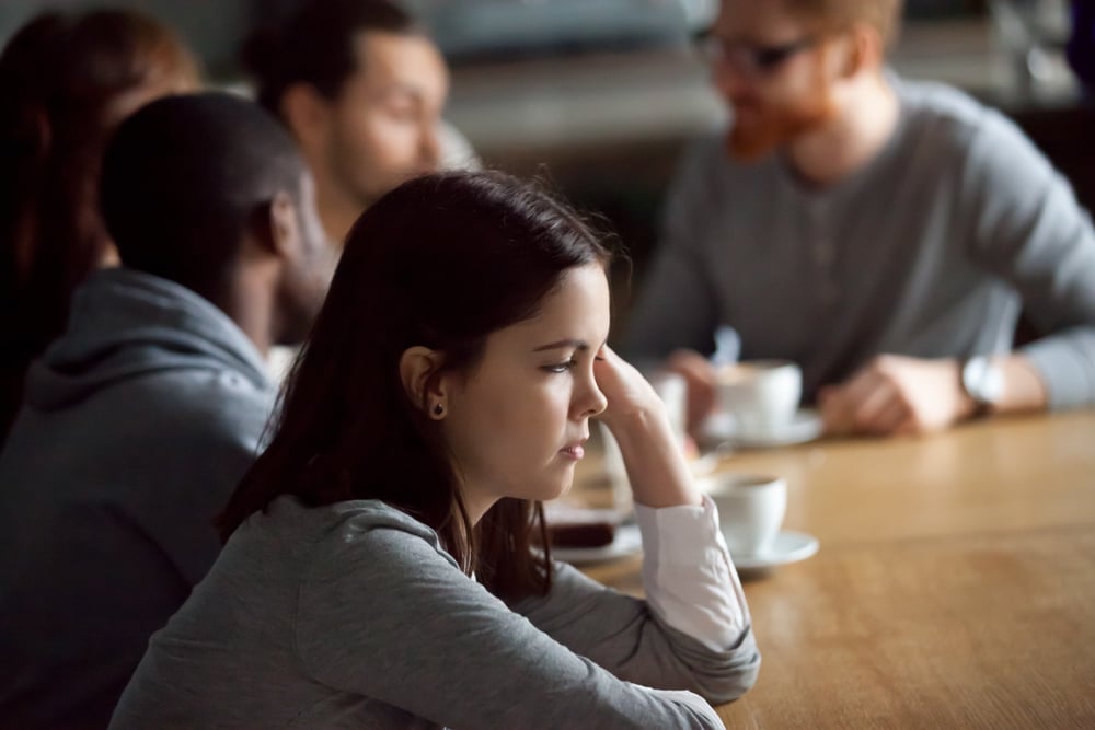 Millenial-woman-frustrated-in-meeting-holiday-messages-to-employees