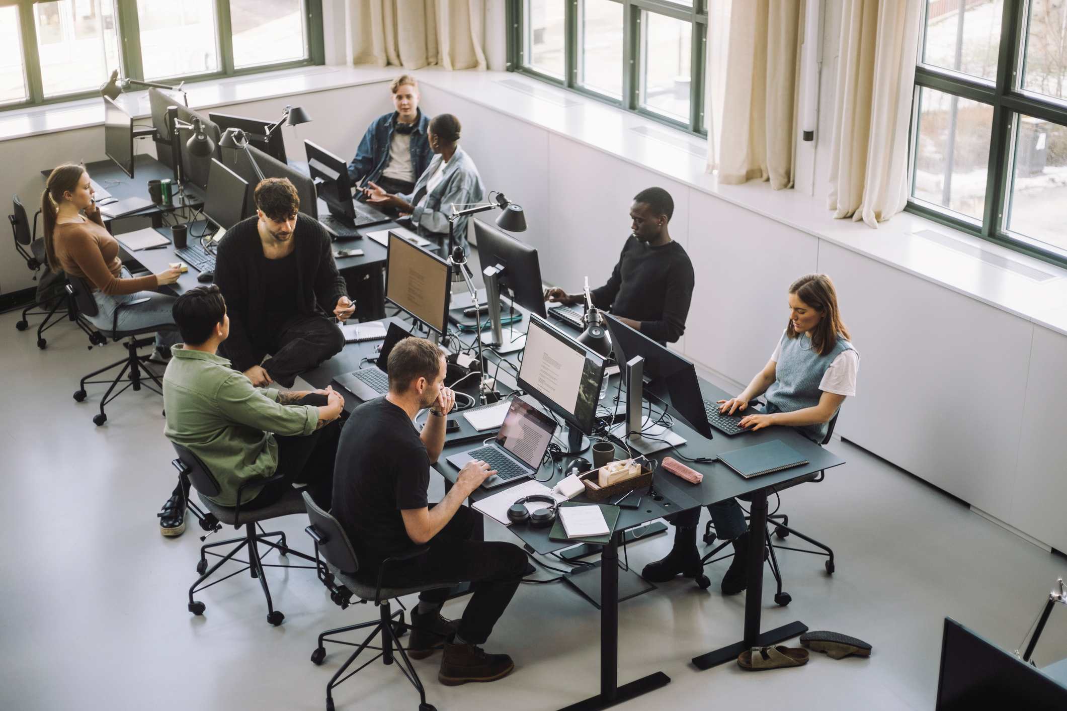 People-at-open-space-office-working-on-computers-current-unemployment-rate