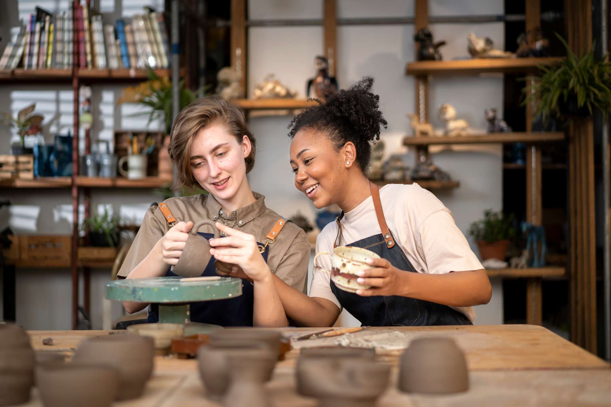 Two-woman-at-pottery-class-laughing-together-i-feel-like-i-dont-belong