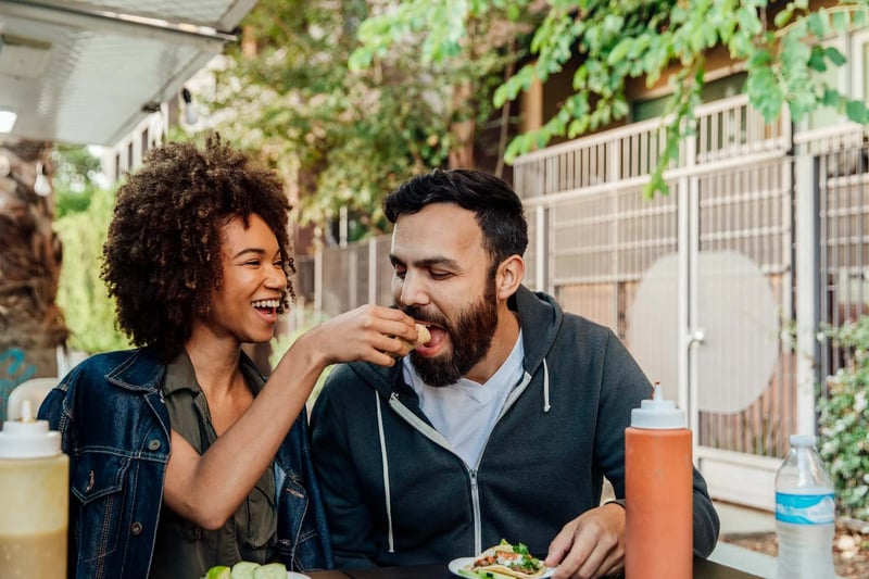 Woman-Feeds-Man-Street-Taco