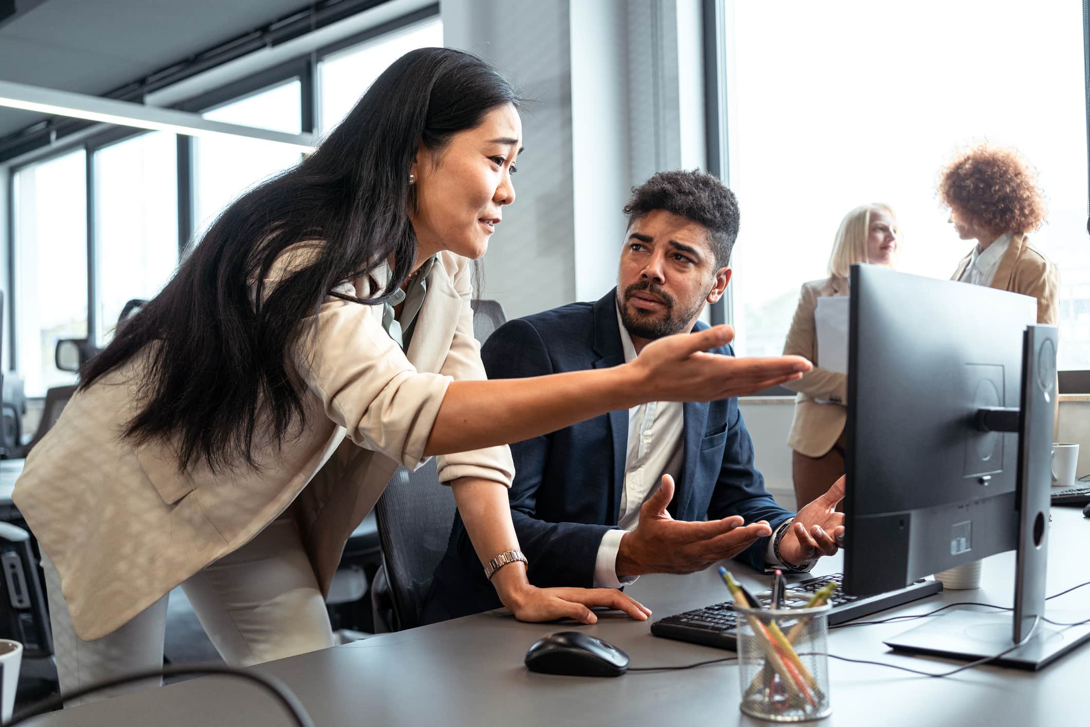 Woman-bothering-coworker-over-non-important-stuff-bullying-at-work