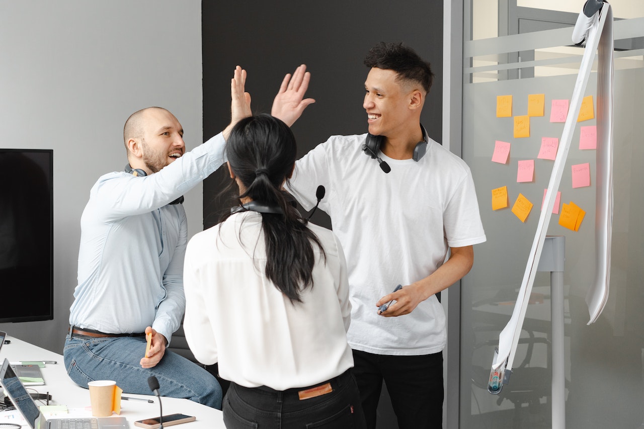 Work-collegues-giving-high-five-to-each-other-start-stop-continue