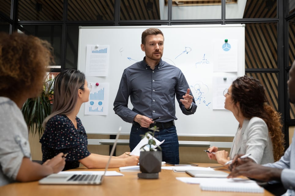 confident-man-giving-a-presentation-how-to-get-over-embarrassment