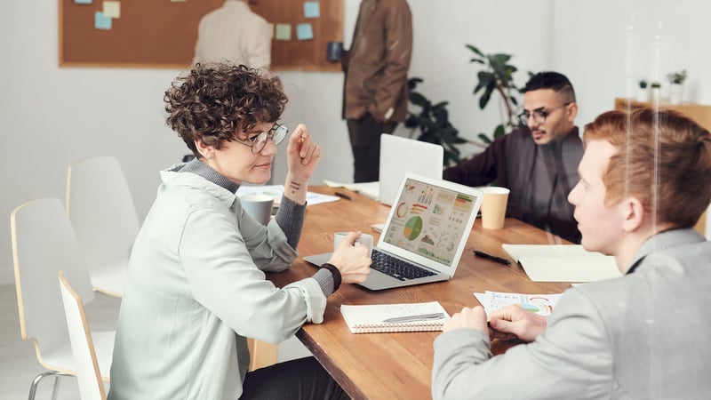 girl talking in business meeting in table