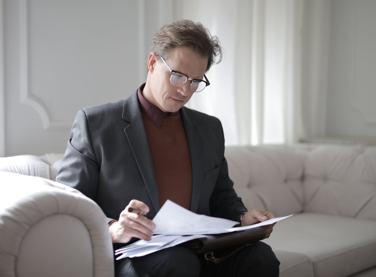 man-analyzing-papers-choice-point