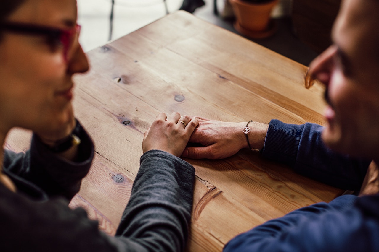 man-and-women-holding-hands-journal-prompts-for-mental-health