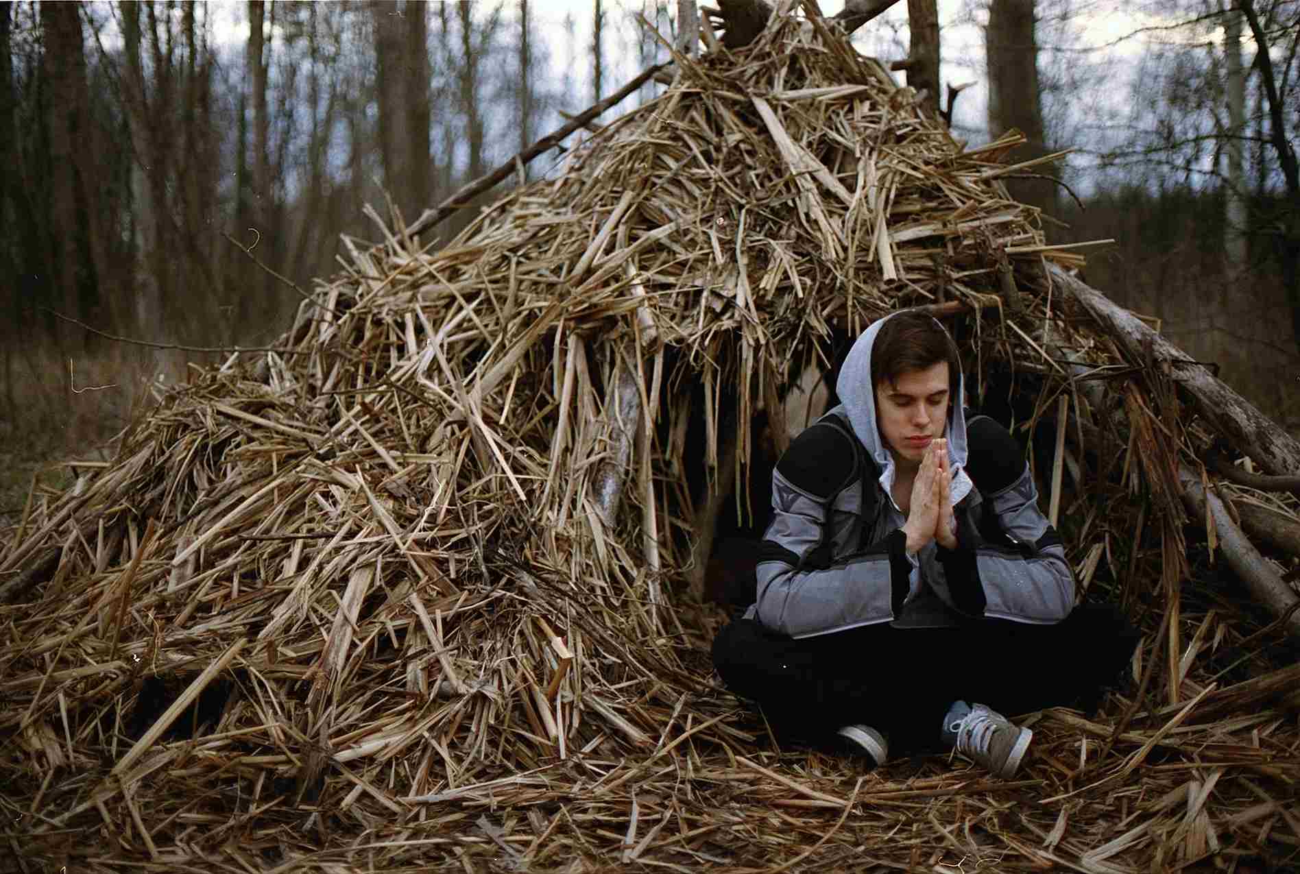 man-meditating-in-a-small-wood-house-internal-monologue